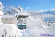 Garden view with snow in the Apokoronas